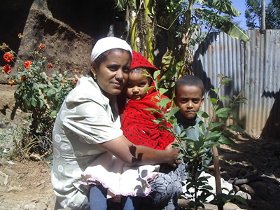 A family in Addis Abeba with their newly planted tree